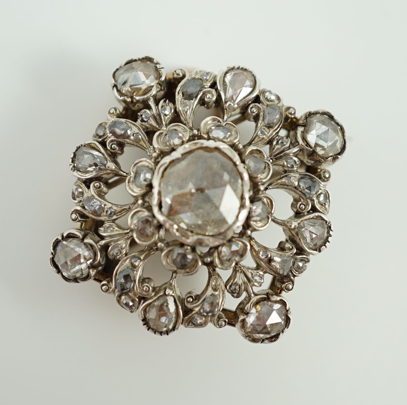A Victorian pierced gold, silver and rose cut diamond set pendant brooch
